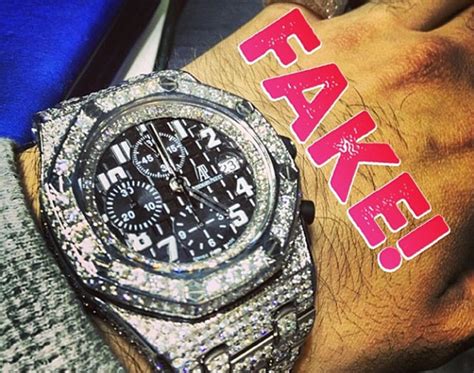 rappers wearing fake watches|rappers wearing diamond rings.